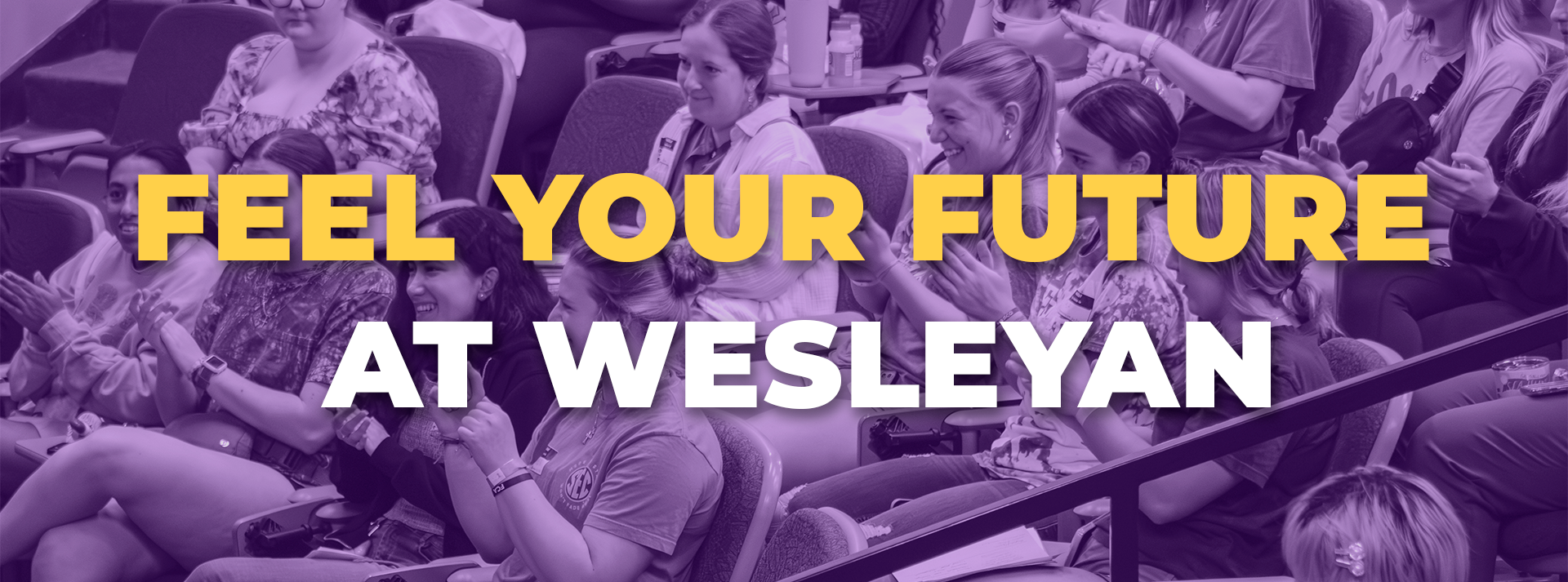 Feel Your Future At Wesleyan Hero Image “Students seated in an auditorium smiling and clapping, overlaid with the text ‘Feel Your Future at Wesleyan.’”