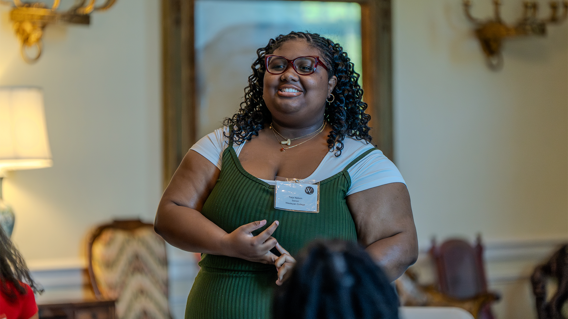 A student introducing herself at the Lettie Pate Whitehead Scholarship Dinner
